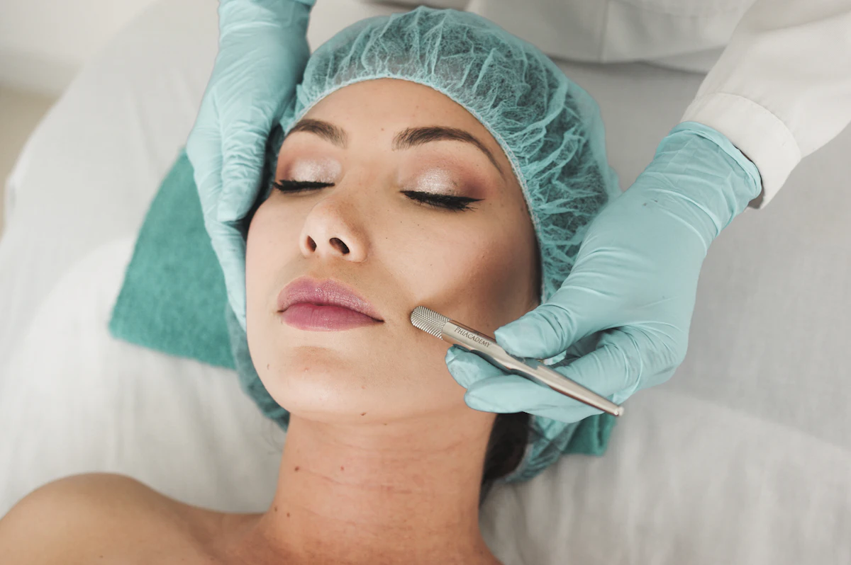 A client receiving a facial treatment from an esthetician